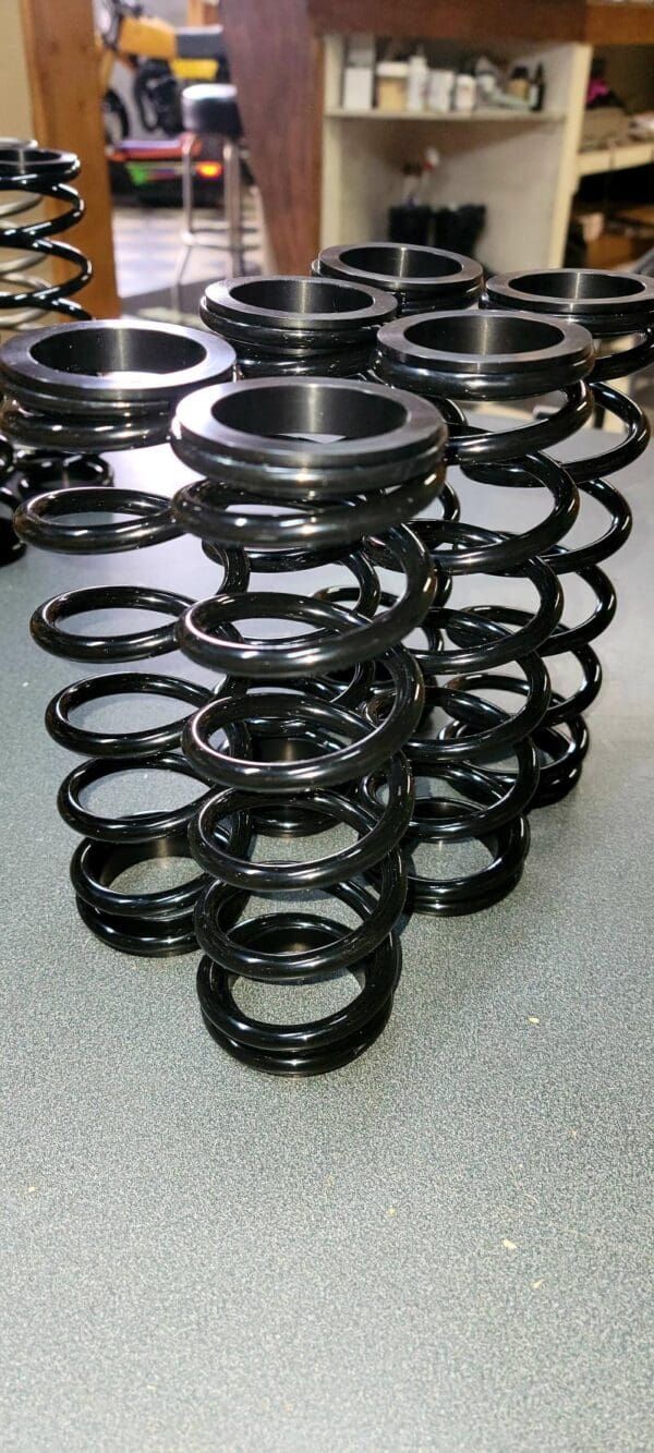 Rear Alpha skid front shock spring